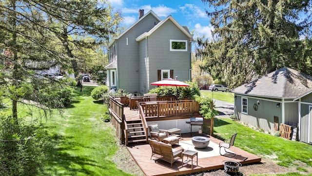 80 Hill St, Walden, NY 12586 - back of house with a yard, a deck, a fire pit, and a chimney