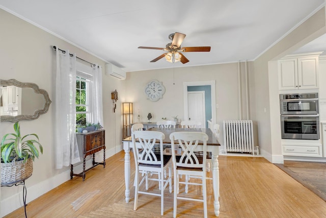 80 Hill St, Walden, NY 12586 - dining space featuring radiator, light wood-type flooring, a wall unit AC, a ceiling fan, and baseboards
