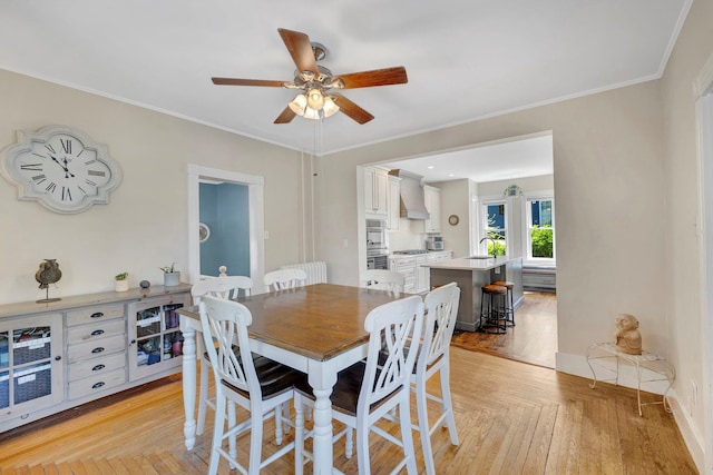 80 Hill St, Walden, NY 12586 - dining space featuring light wood finished floors, ornamental molding, and a ceiling fan