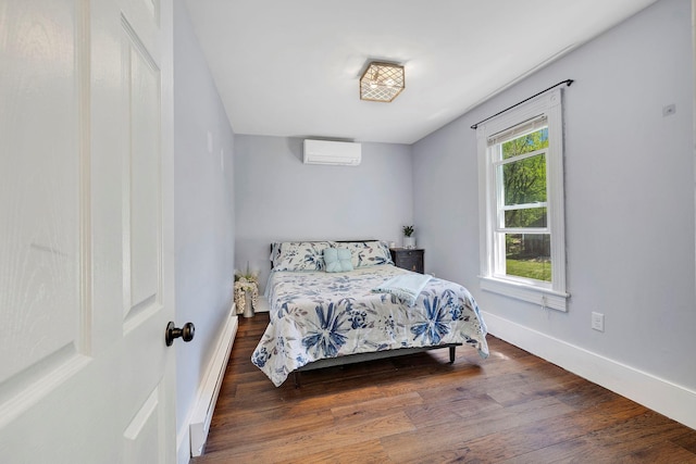 80 Hill St, Walden, NY 12586 - bedroom featuring baseboards, wood finished floors, a baseboard heating unit, and a wall unit AC