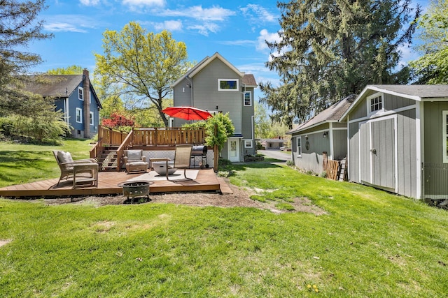 80 Hill St, Walden, NY 12586 - view of yard featuring an outbuilding, a wooden deck, a fire pit, and a storage unit