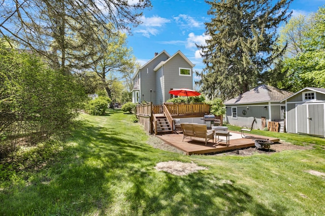 80 Hill St, Walden, NY 12586 - view of yard featuring an outdoor structure, a deck, stairs, and a storage unit