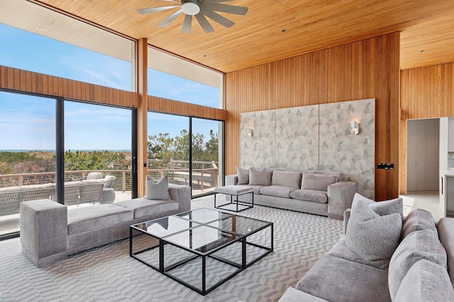 199 Dune Rd, Westhampton Beach, NY 11978 - living area featuring wood ceiling, a high ceiling, a ceiling fan, and a wealth of natural light