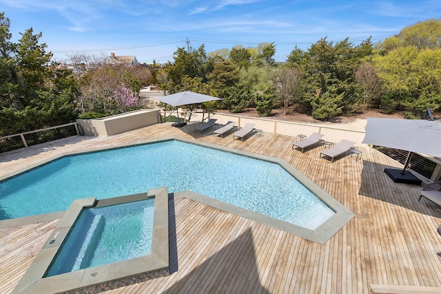 199 Dune Rd, Westhampton Beach, NY 11978 - view of swimming pool featuring a pool with connected hot tub and a wooden deck