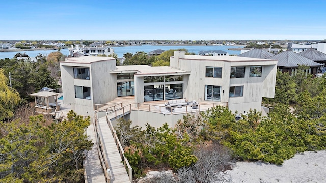 199 Dune Rd, Westhampton Beach, NY 11978 - rear view of property with a water view and a balcony