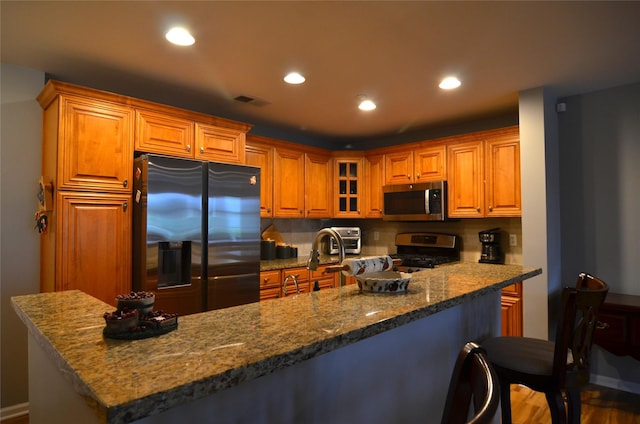 1308 Round Pointe Dr Unit 1308, Haverstraw, NY 10927 - kitchen with stainless steel appliances, a sink, dark stone countertops, tasteful backsplash, and recessed lighting