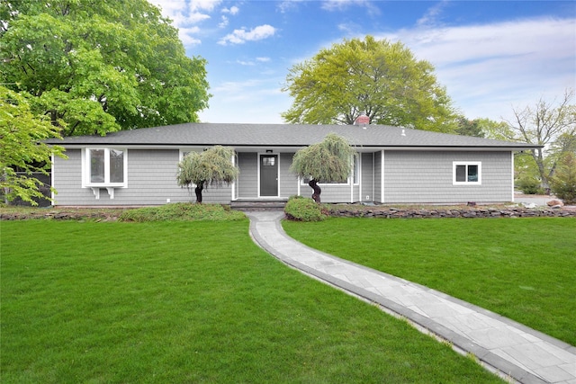 single story home with a front yard