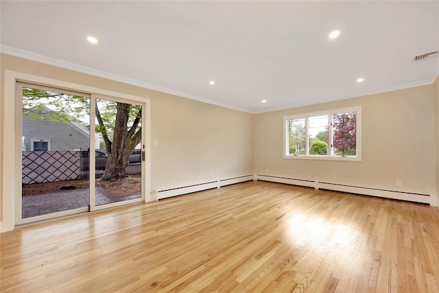 empty room with plenty of natural light, a baseboard radiator, wood finished floors, crown molding, and recessed lighting