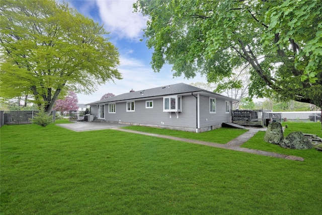 back of house with a patio