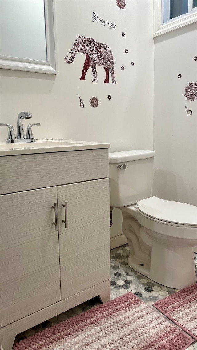 133 Highland Pl, Brooklyn, NY 11208 - bathroom featuring toilet, vanity, and baseboards