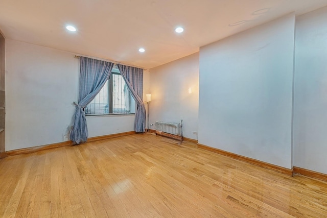 372 Grand Ave, Brooklyn, NY 11238 - empty room featuring radiator, wood finished floors, baseboards, and recessed lighting
