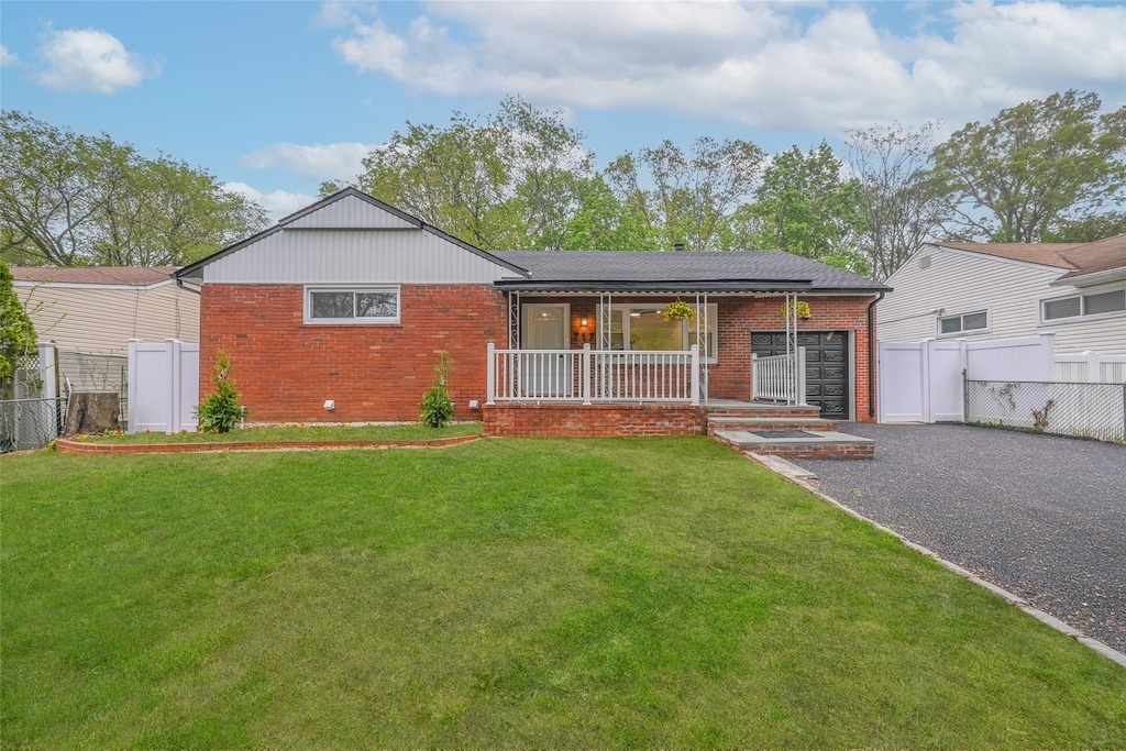 717 Janos Ln, West Hempstead, NY 11552 - ranch-style home with brick siding and a porch