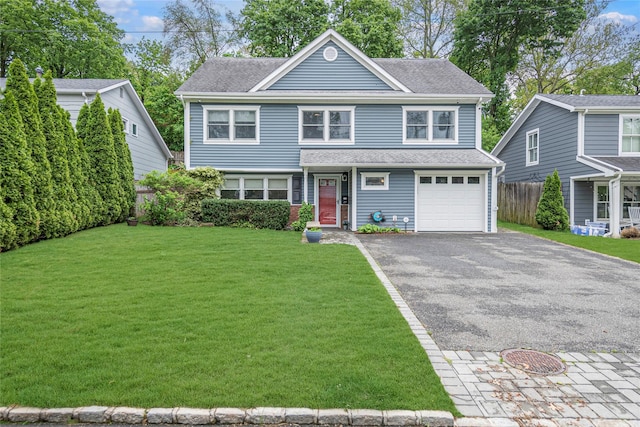 view of front of house featuring asphalt driveway, a garage, and roof with shingles