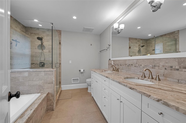 full bath with baseboards, a shower stall, recessed lighting, backsplash, and double vanity