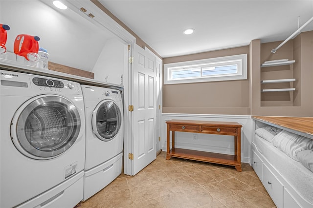 clothes washing area with separate washer and dryer