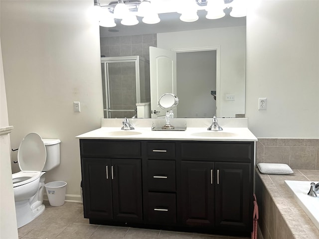 bathroom featuring a sink, toilet, and a shower stall