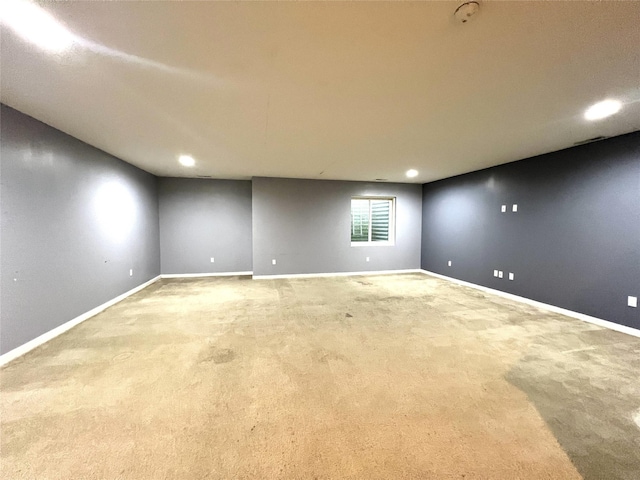 spare room with carpet, baseboards, and recessed lighting