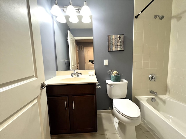 bathroom featuring toilet, vanity, tile patterned floors, tub / shower combination, and baseboards