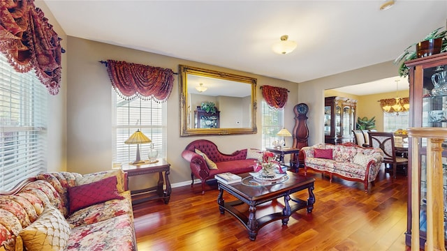 2041 Independence Dr, New Windsor, NY 12553 - living area featuring healthy amount of natural light, a chandelier, hardwood / wood-style floors, and baseboards