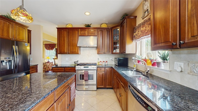 2041 Independence Dr, New Windsor, NY 12553 - kitchen with stainless steel appliances, under cabinet range hood, a sink, glass insert cabinets, and dark stone countertops