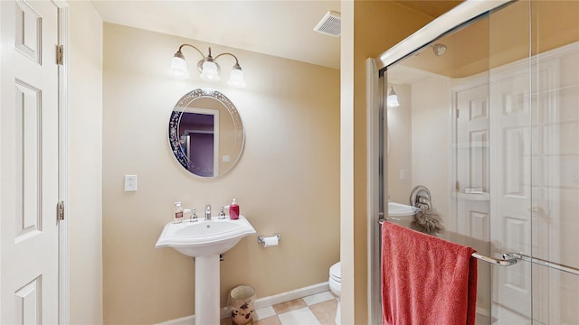 2041 Independence Dr, New Windsor, NY 12553 - bathroom featuring toilet, a stall shower, baseboards, and a sink