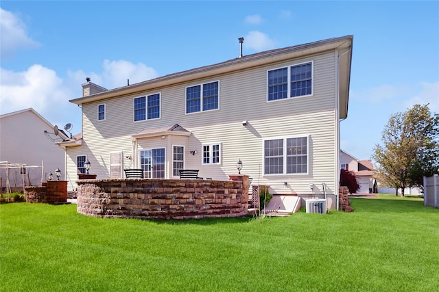 2041 Independence Dr, New Windsor, NY 12553 - back of property with a lawn, central air condition unit, and a chimney