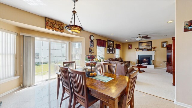 2041 Independence Dr, New Windsor, NY 12553 - dining room featuring a ceiling fan, baseboards, a lit fireplace, and recessed lighting