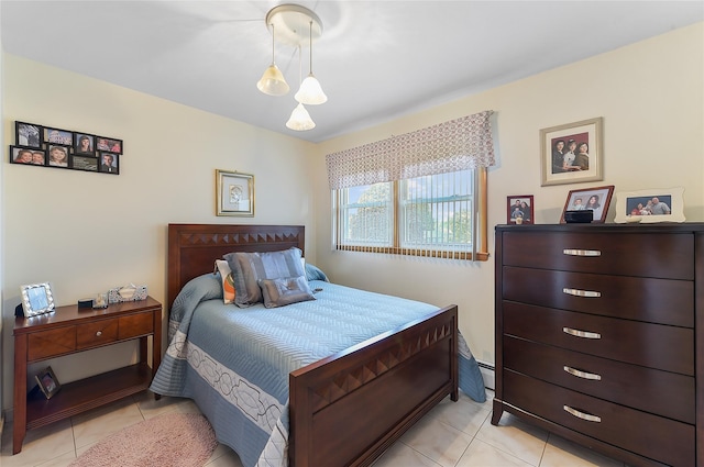 bedroom with light tile patterned floors