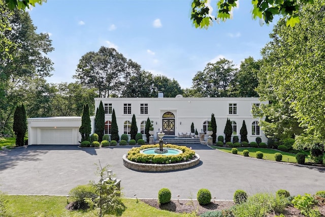 65 Round Hill Rd, Armonk, NY 10504 - mediterranean / spanish house with curved driveway and stucco siding