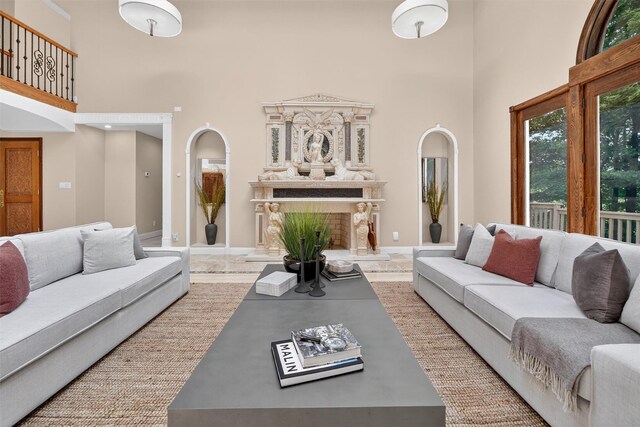 65 Round Hill Rd, Armonk, NY 10504 - living area featuring a high ceiling and a fireplace with raised hearth