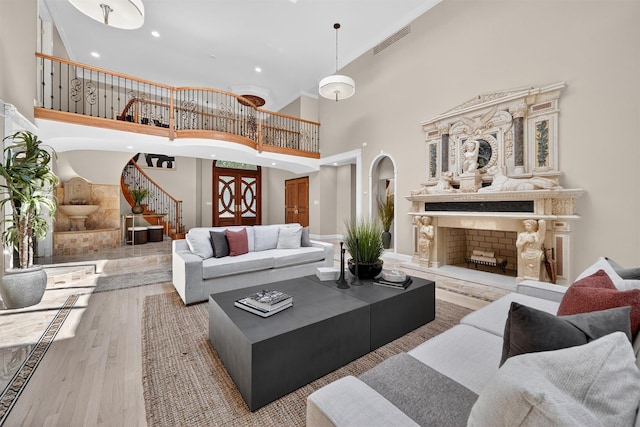 65 Round Hill Rd, Armonk, NY 10504 - living room featuring high vaulted ceiling, stairway, wood finished floors, recessed lighting, and ornamental molding