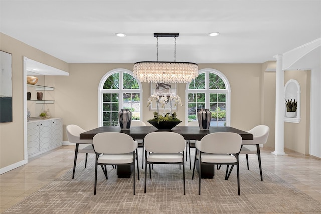 65 Round Hill Rd, Armonk, NY 10504 - dining area with healthy amount of natural light, a chandelier, recessed lighting, decorative columns, and light tile patterned floors