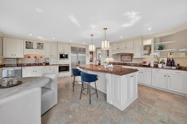 65 Round Hill Rd, Armonk, NY 10504 - kitchen featuring appliances with stainless steel finishes, decorative backsplash, a kitchen bar, dark stone counters, and recessed lighting