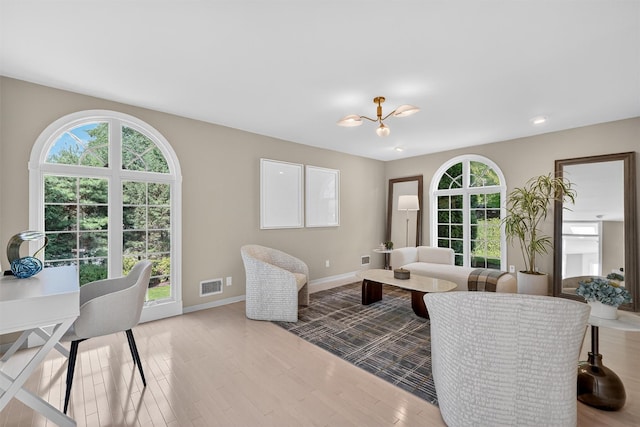 65 Round Hill Rd, Armonk, NY 10504 - living room featuring healthy amount of natural light, a chandelier, wood finished floors, and recessed lighting