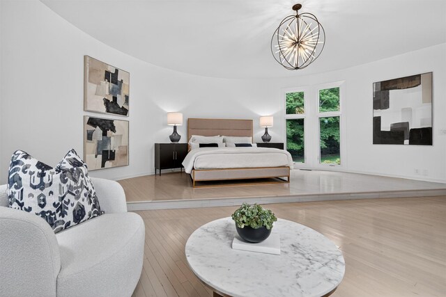 65 Round Hill Rd, Armonk, NY 10504 - bedroom with a chandelier and wood finished floors