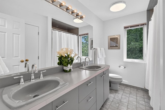 65 Round Hill Rd, Armonk, NY 10504 - bathroom with plenty of natural light, double vanity, tile patterned floors, and a shower with curtain