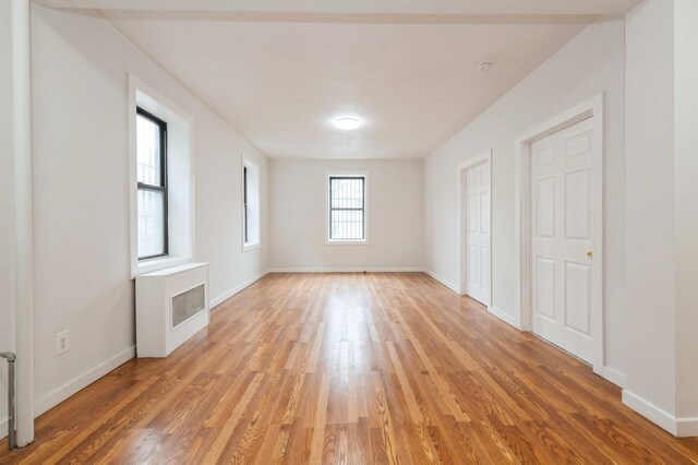 62-64 Saunders Unit K2, Rego Park, NY 11374 - unfurnished room featuring light wood-style flooring and baseboards
