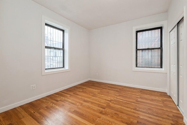 62-64 Saunders Unit K2, Rego Park, NY 11374 - unfurnished room featuring light wood-style flooring and baseboards