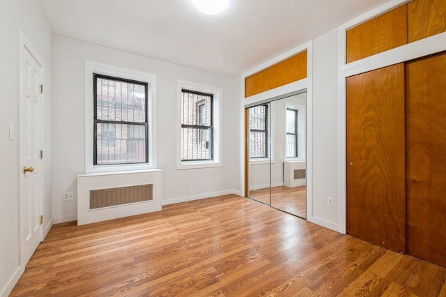 62-64 Saunders Unit K2, Rego Park, NY 11374 - unfurnished bedroom featuring light wood finished floors and baseboards
