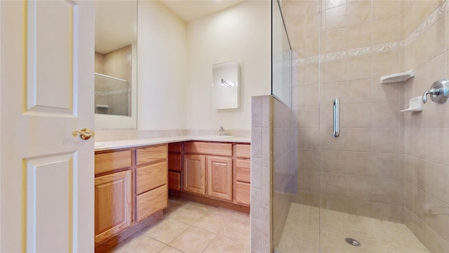 6910 Beach Front Rd, Arverne, NY 11692 - bathroom featuring double vanity, a shower stall, and tile patterned flooring