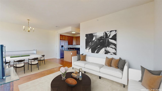 6910 Beach Front Rd, Arverne, NY 11692 - living area with a chandelier and light wood-type flooring
