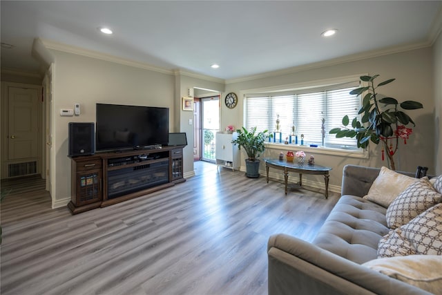 living area featuring wood finished floors, baseboards, and recessed lighting