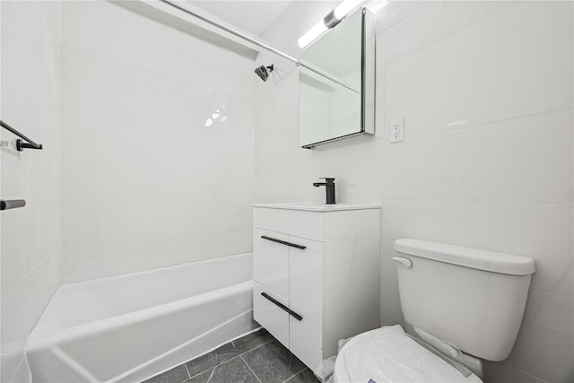 bathroom featuring toilet, shower / bathing tub combination, and vanity