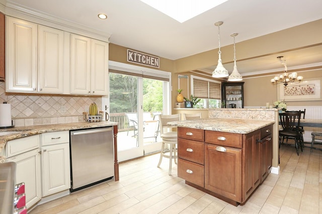 kitchen with stainless steel dishwasher, decorative backsplash, hanging light fixtures, light wood-type flooring, and light stone countertops