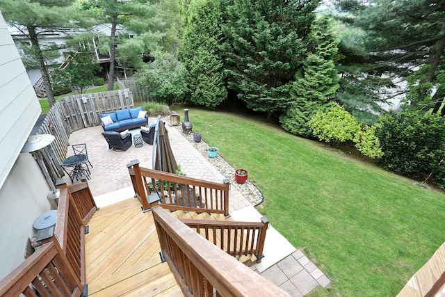 view of yard with outdoor lounge area, a patio, and a deck