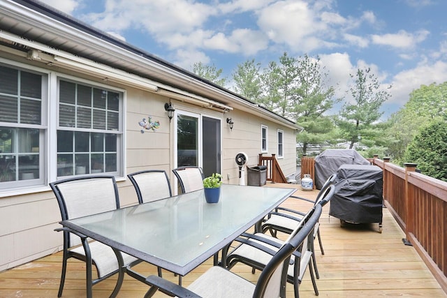 deck featuring outdoor dining area