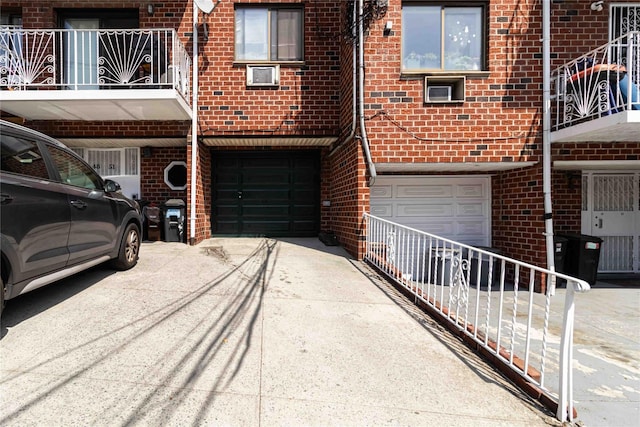 garage with concrete driveway