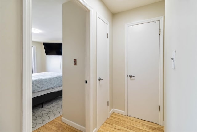 corridor with light wood-style floors