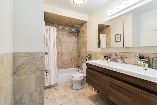 bathroom featuring tile walls, vanity, shower / bath combination with curtain, and toilet