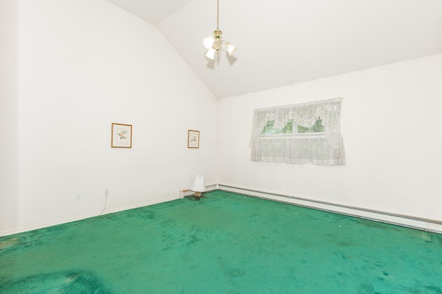 carpeted empty room with vaulted ceiling and a baseboard heating unit